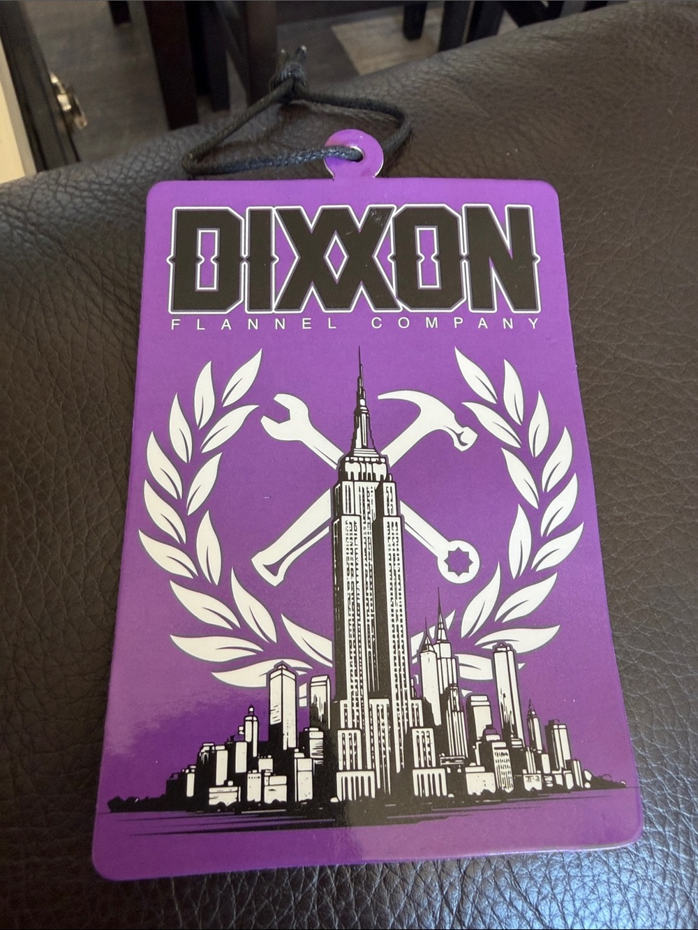 DIXXON Purple and White Graphic Tag with City Skyline